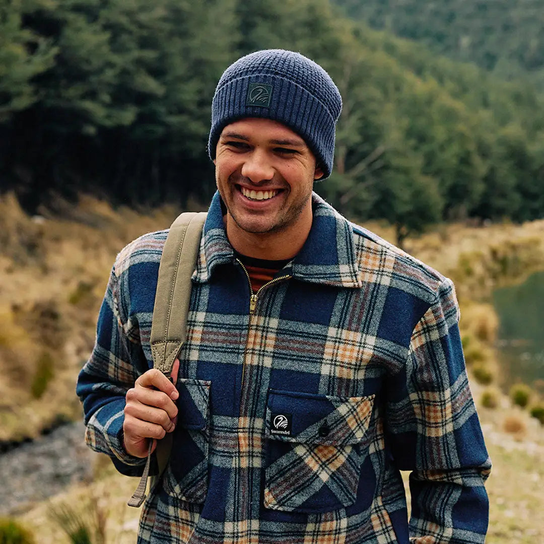 Man wearing blue plaid woolen Swanndri Ranger Wool Zip Front Bushshirt with chest pockets