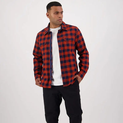 Red and navy checkered flannel shirt over white tee, perfect for Taranaki Tailor country clothing