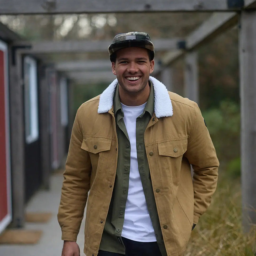 Man wearing Swanndri Wentworth Valley v2 Wool Cap with tan jacket and camo cap