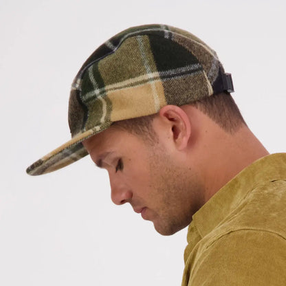 Man wearing Swanndri Wentworth Valley v2 Wool Cap in green, black, and tan plaid