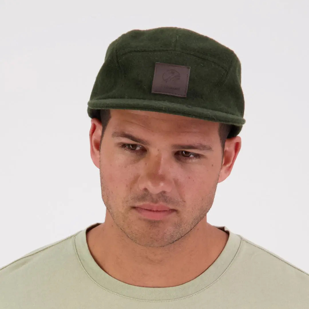 Man wearing Swanndri Wentworth Valley V2 Wool Cap with dark green five-panel design
