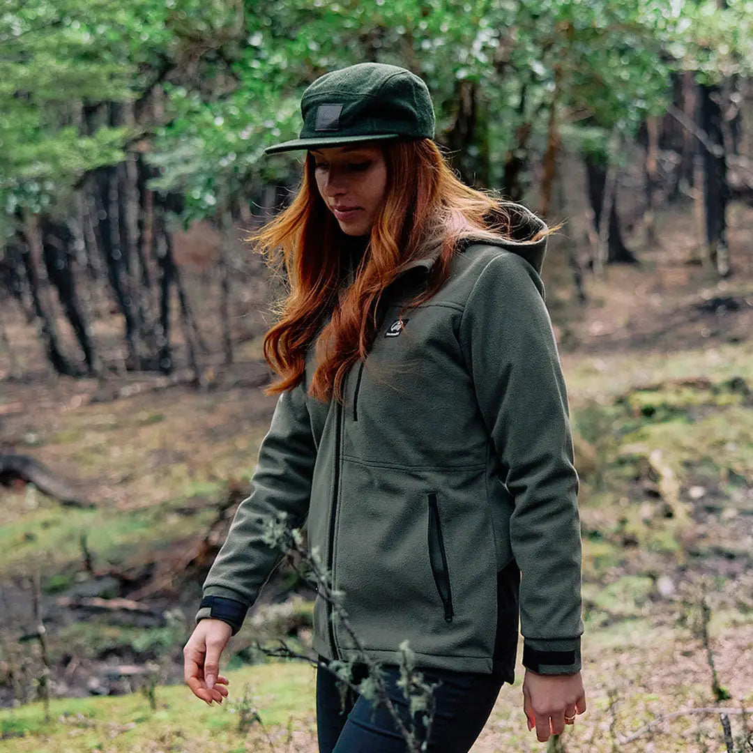 Woman in dark green Swanndri Wentworth Valley V2 Wool Cap and fleece jacket outdoors