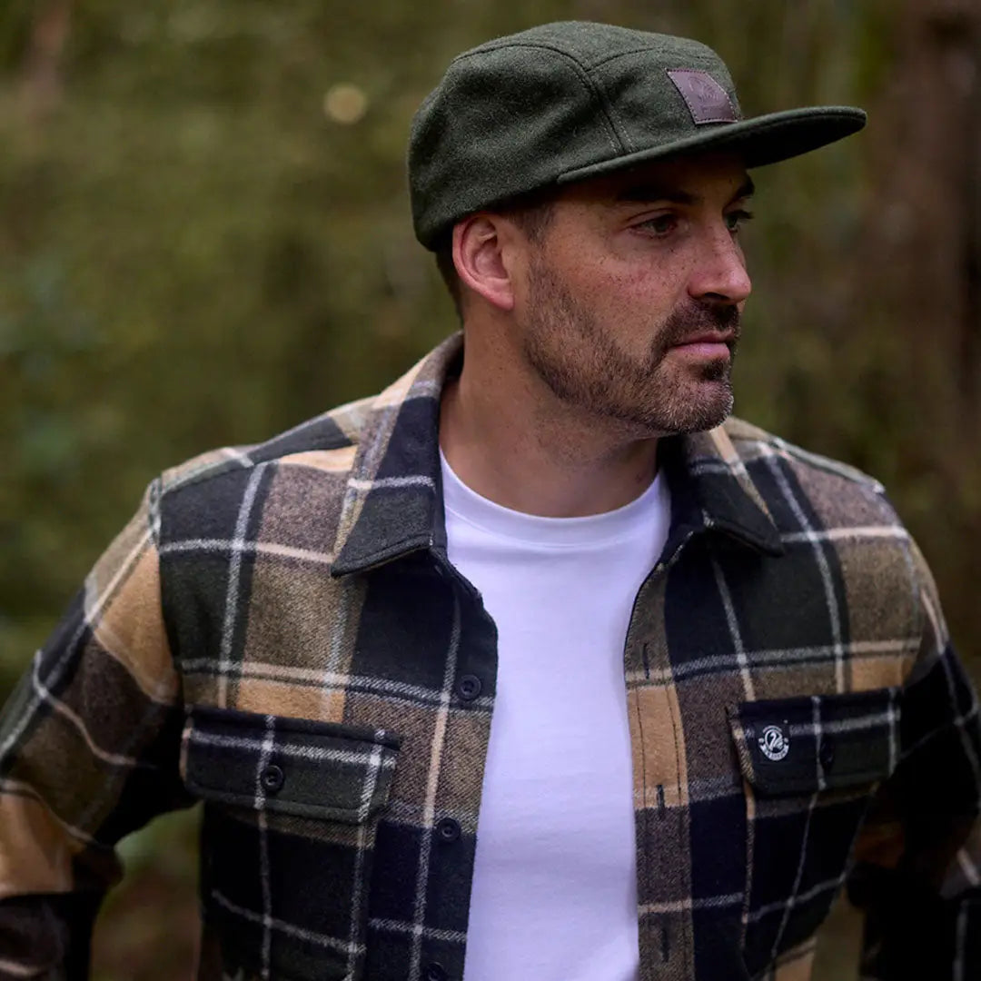Man wearing Swanndri Wentworth Valley v2 Wool Cap and plaid flannel shirt