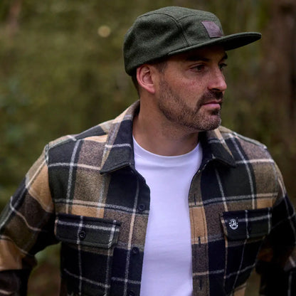 Man wearing Swanndri Wentworth Valley v2 Wool Cap and plaid flannel shirt