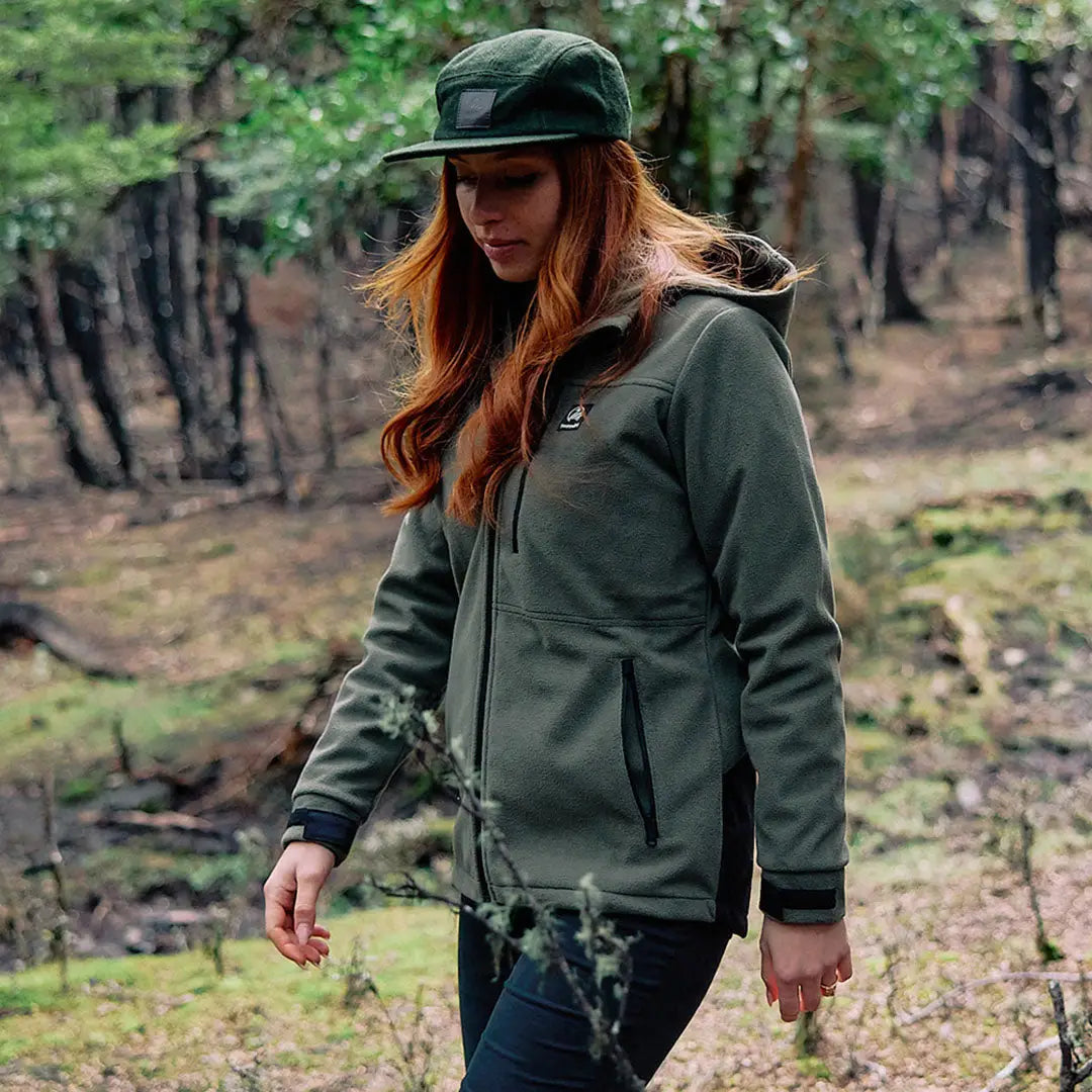 Woman in dark green Swanndri High Rock zip water resistant recycled fleece hoodie