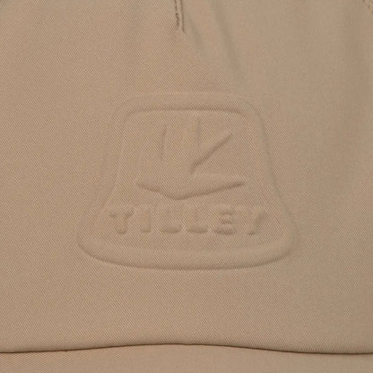 Beige fabric with embossed logo on Tilley Tech Travel Cap for stylish adventures