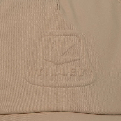 Beige fabric with embossed logo on Tilley Tech Travel Cap for stylish adventures