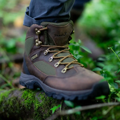 Rugged brown Treksta Warwick GTX hunting boots with Gore-Tex waterproofing on mossy ground