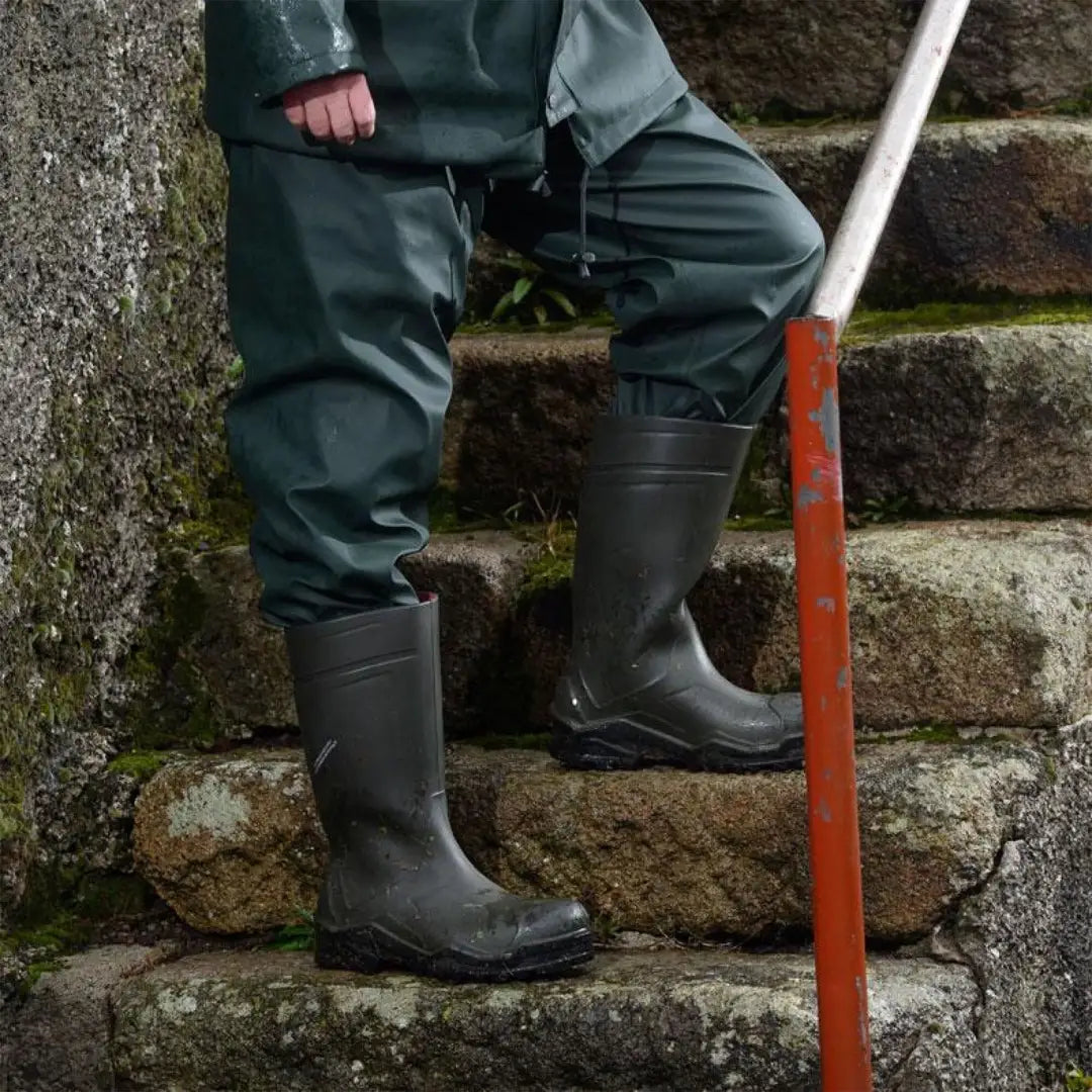 Dark green rubber boots with textured soles from Xpert Swampmaster Stormgear waterproof trousers